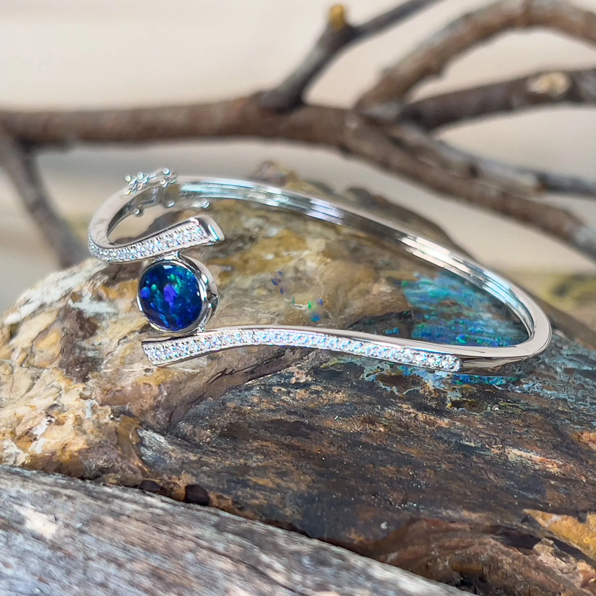 Sterling Silver cross over snap bangle with Opal triplet and cz