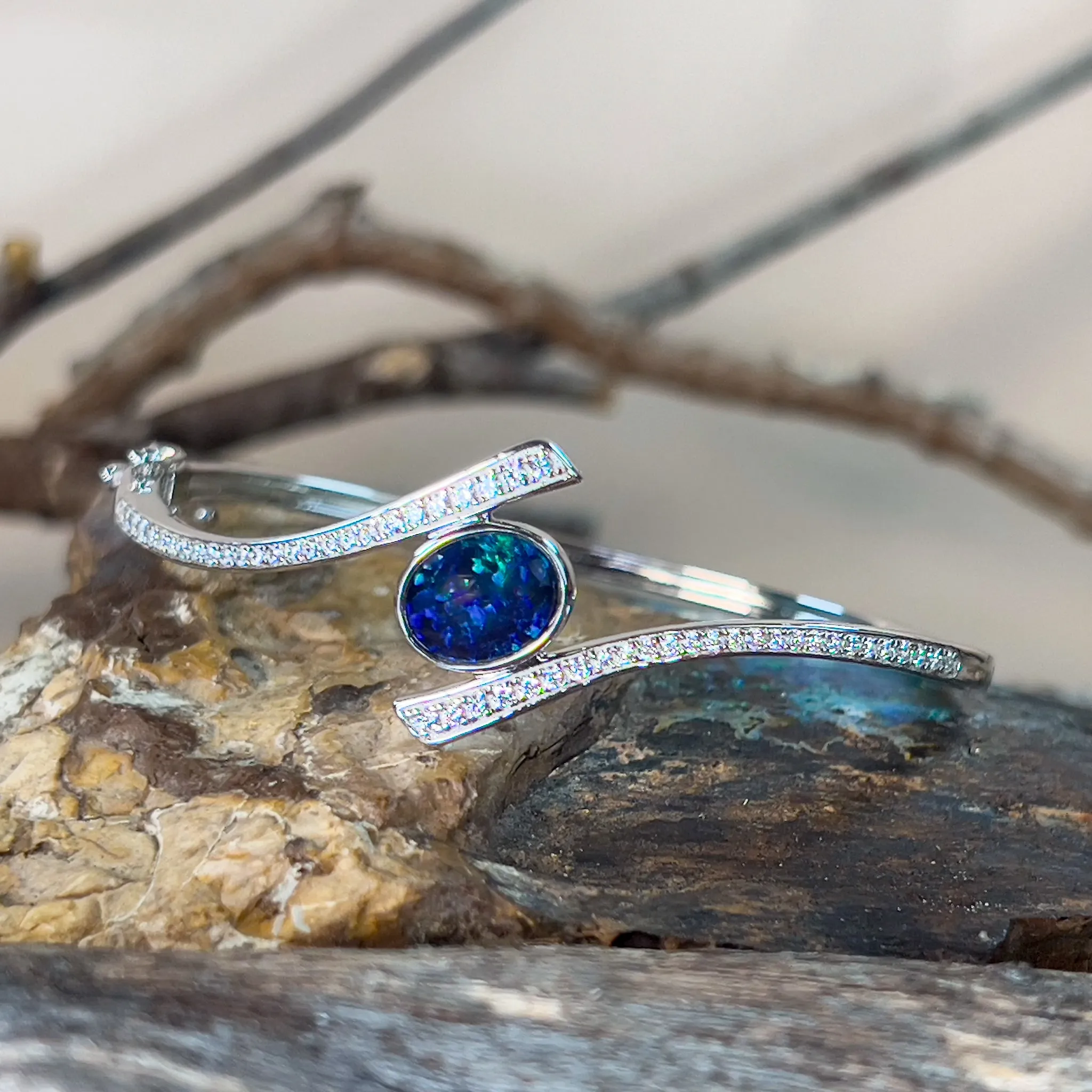 Sterling Silver cross over snap bangle with Opal triplet and cz