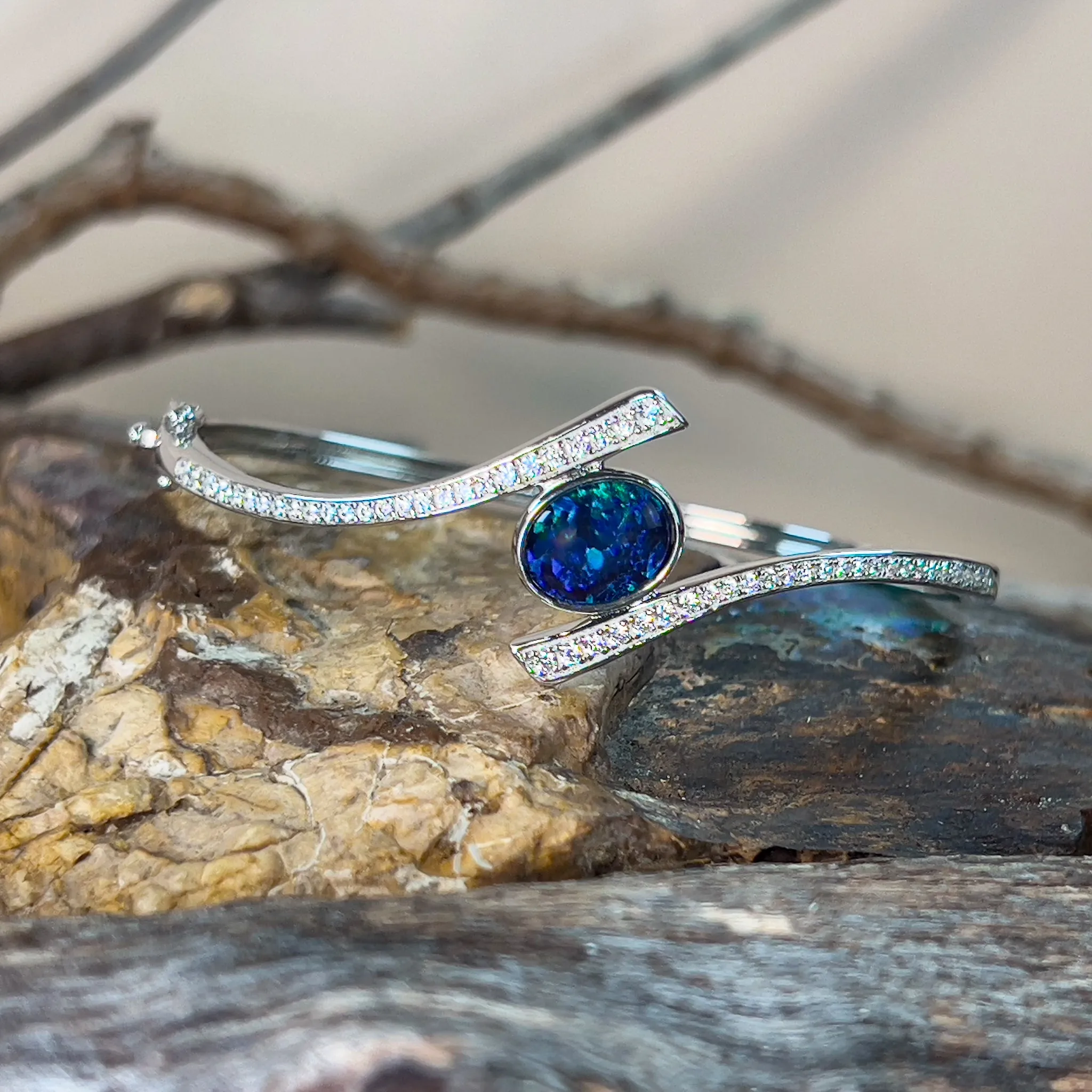 Sterling Silver cross over snap bangle with Opal triplet and cz