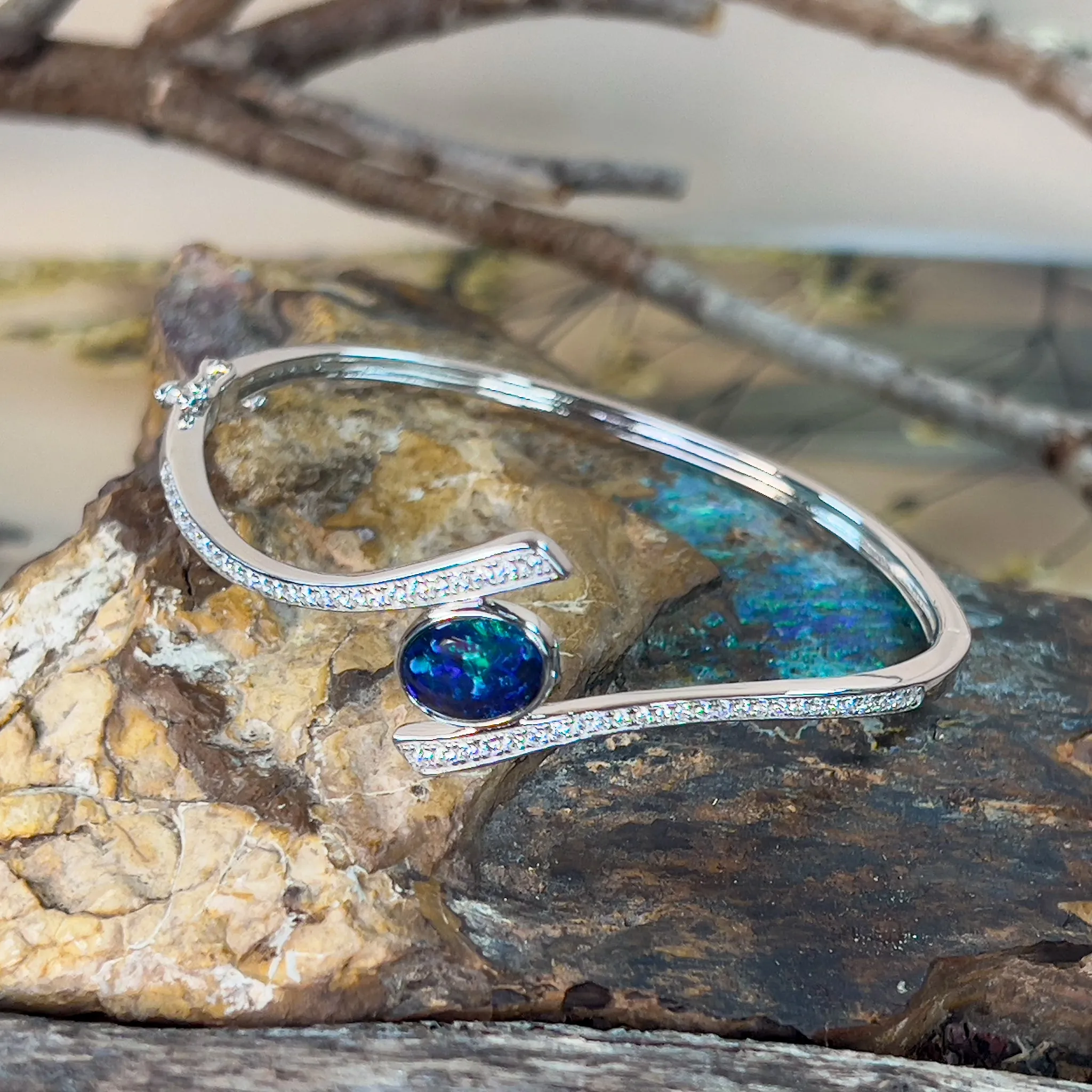 Sterling Silver cross over snap bangle with Opal triplet and cz